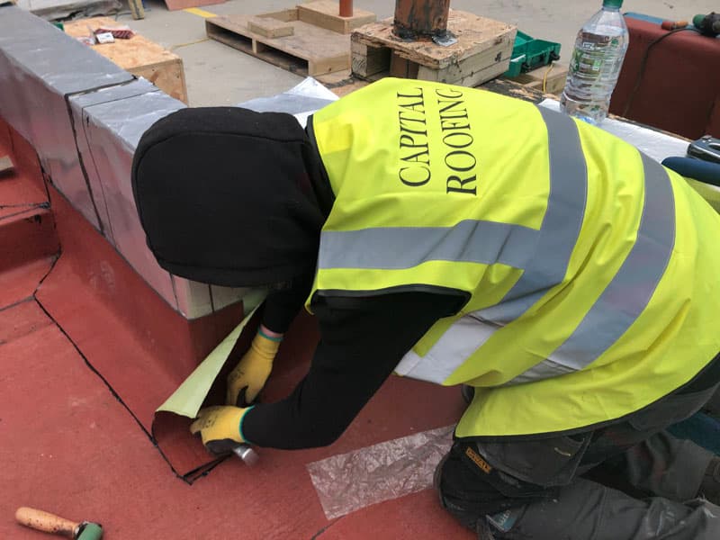Apprentice training with experienced roofers